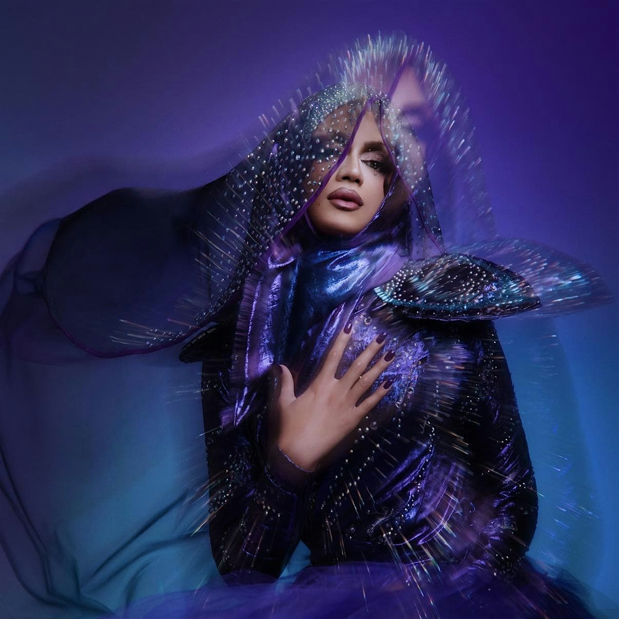 Emaan La’Belle in a sculptural, crystal-covered stage look